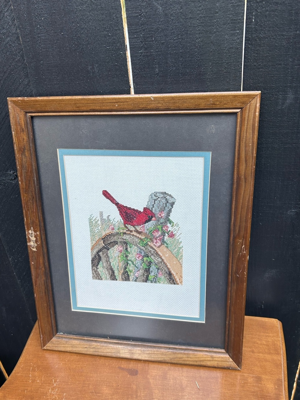 framed, hand-stitched counted cross-stitch piece vibrant red cardinal Art decor